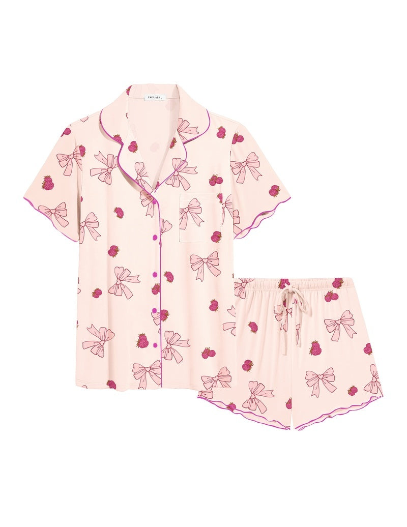 Pink ruffle button-up pajama set with heart-and-bow print and matching drawstring shorts