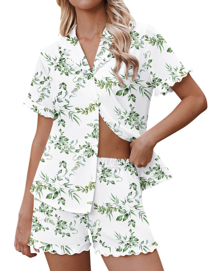 White pajama set with green leaf print, button-down top and ruffle shorts