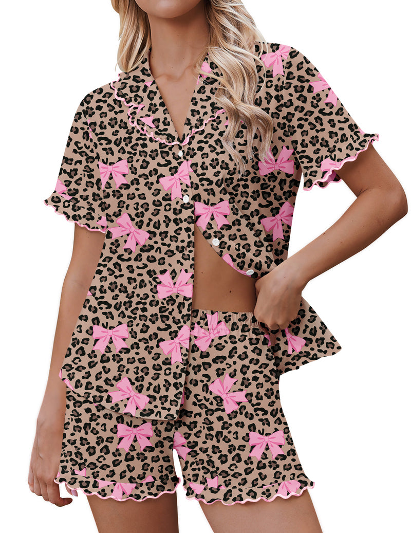 Leopard pajama set with pink bow details, short-sleeve button top and ruffle shorts