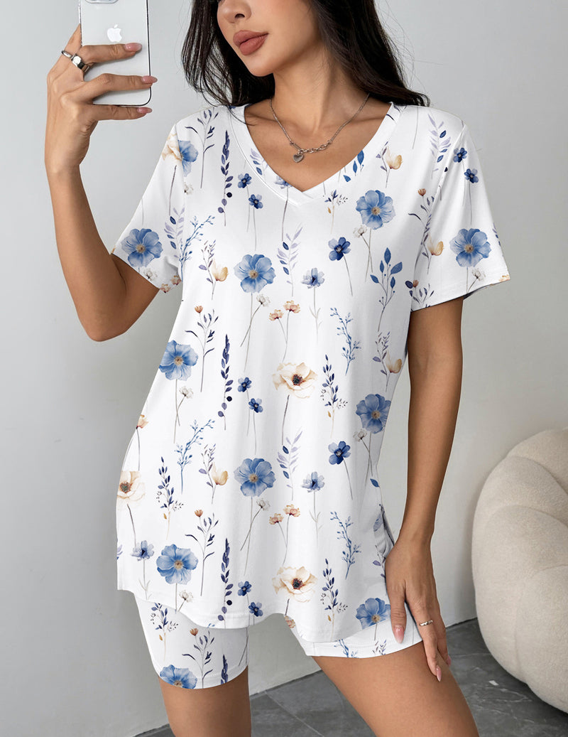 White pajama set with blue flower print V-neck top and matching biker shorts