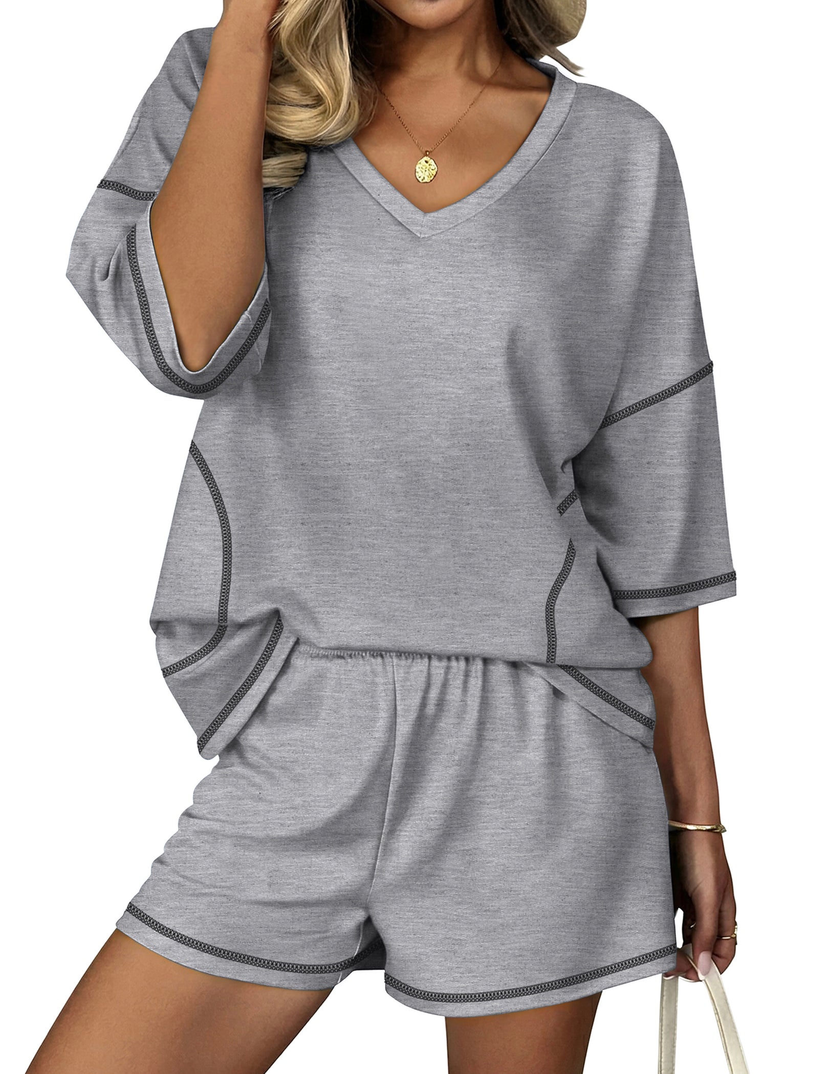 Grey lounge set with V-neck top and elastic-waist shorts, contrast trim