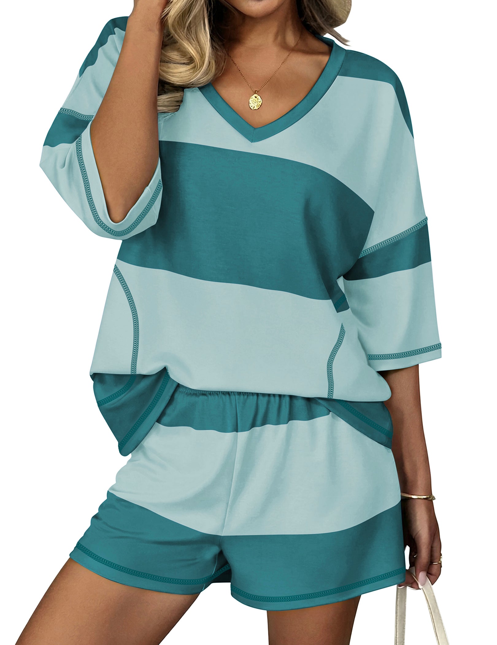 Light blue lounge set with dark teal blocks: V-neck top and elastic shorts