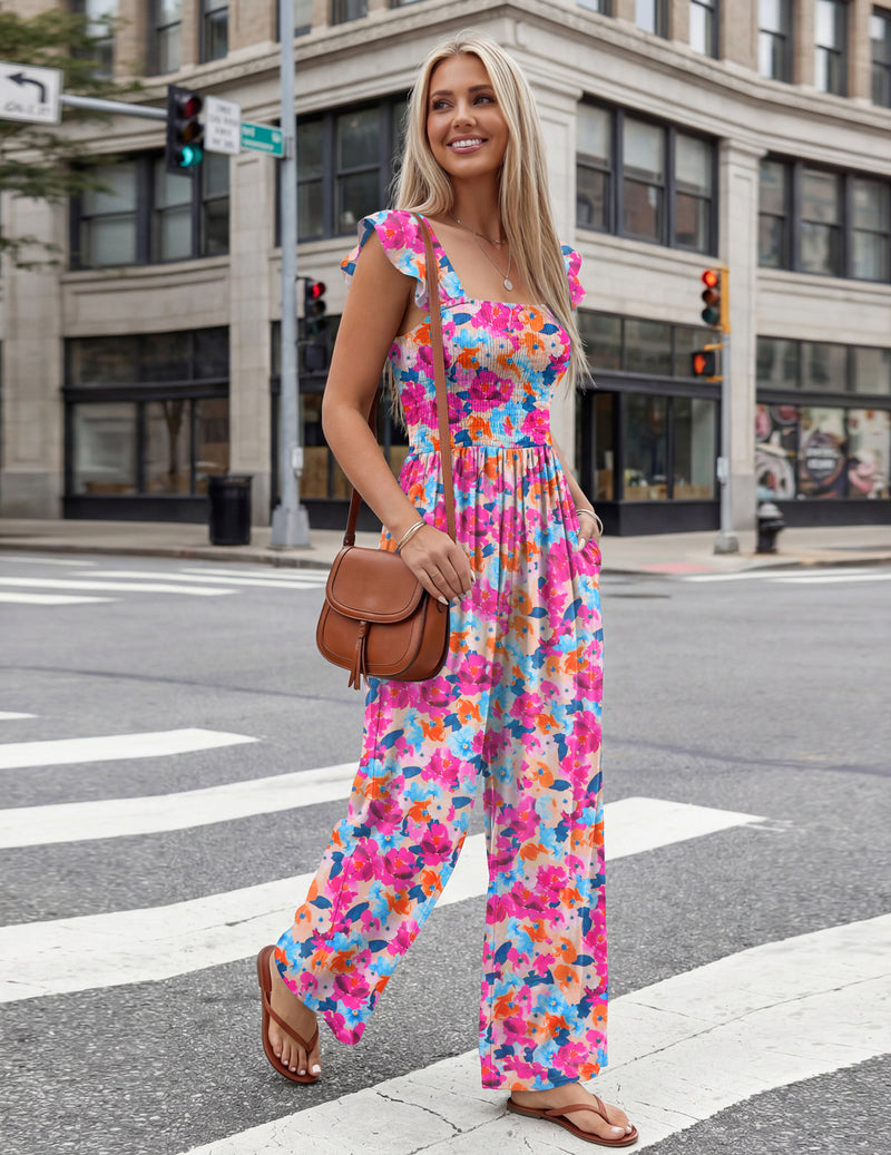 Pink multi-floral smocked wide-leg jumpsuit with square neckline and ruffled shoulders
