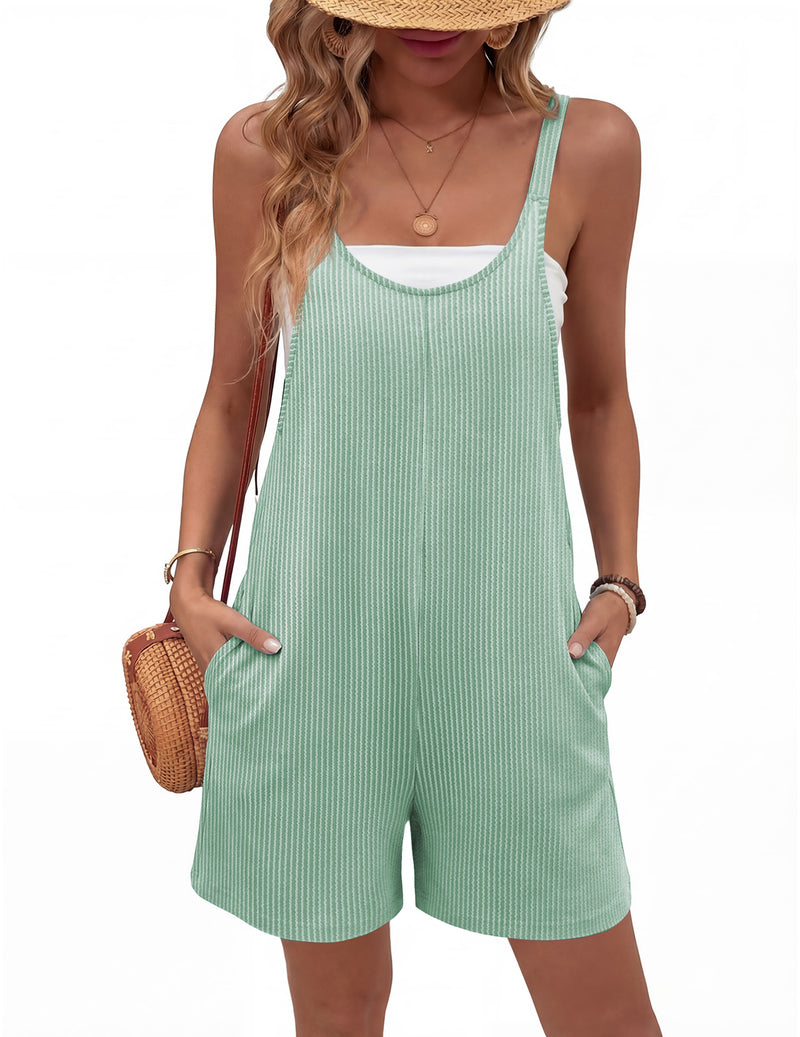 Mint green sleeveless ribbed knit romper shorts jumpsuit with pockets and wide straps.