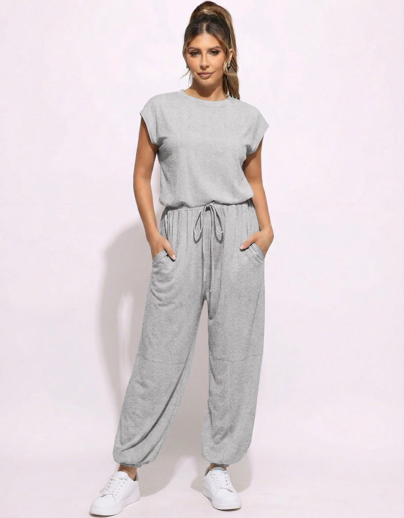 Heather gray one-piece jogger jumpsuit with drawstring waist and relaxed tapered pants