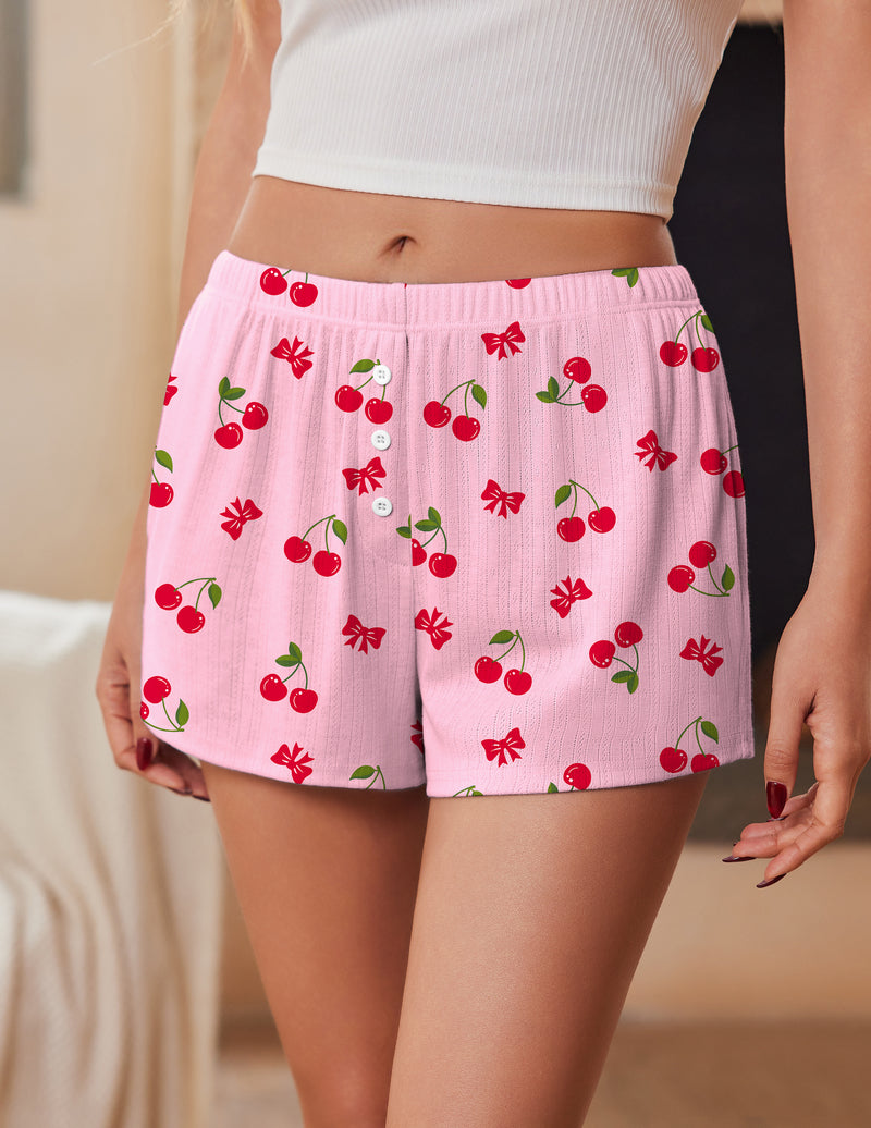 Pink pajama shorts with elastic waistband and cherry print with button front