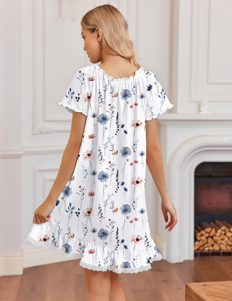 White cotton nightgown with blue floral print and lace-trimmed ruffled hem