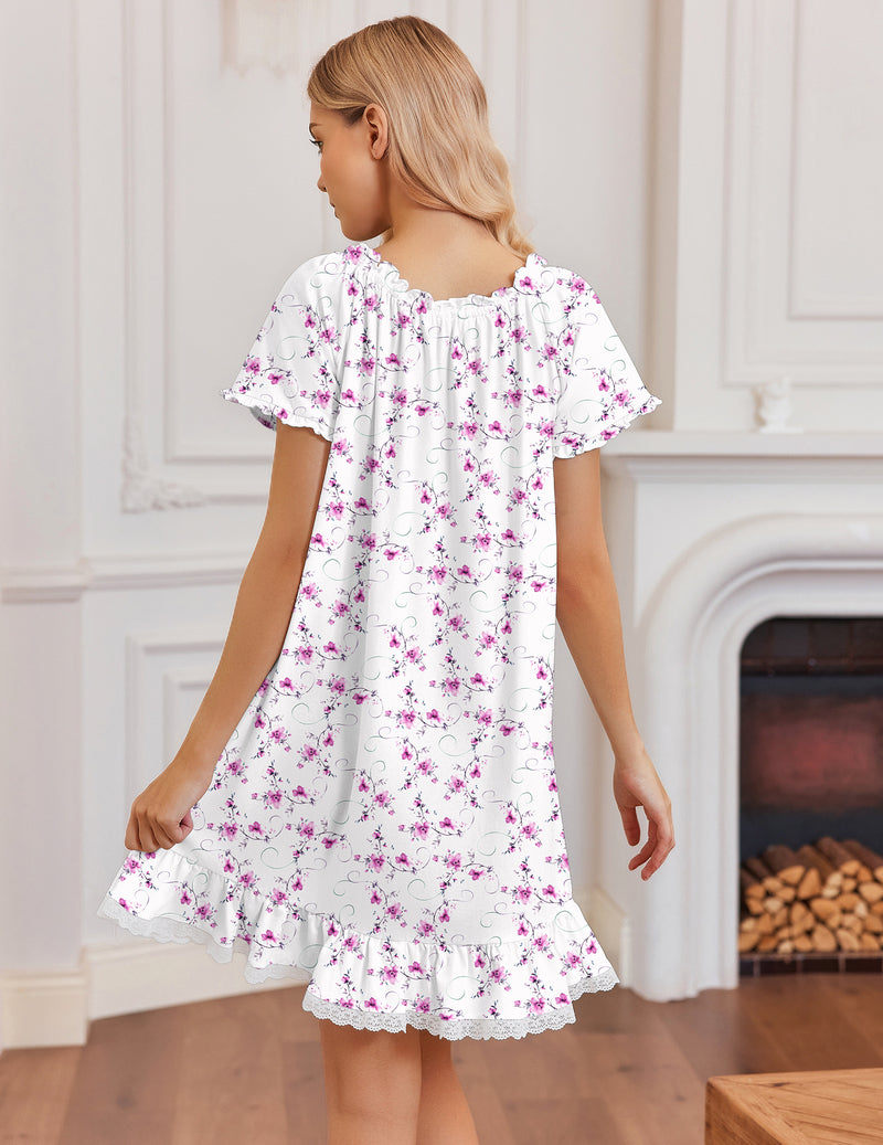 White cotton nightgown with purple floral print and lace-trim ruffled hem, short sleeves