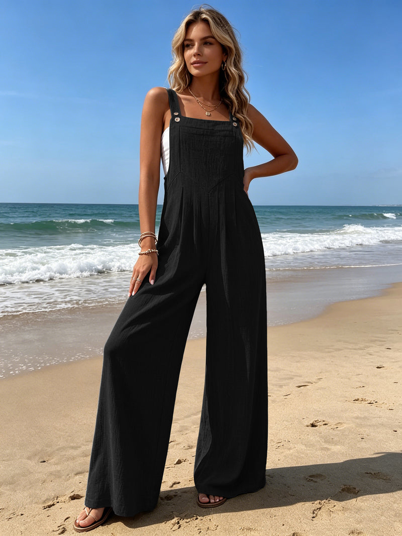 Black wide-leg sleeveless overalls with adjustable straps and gathered bib front
