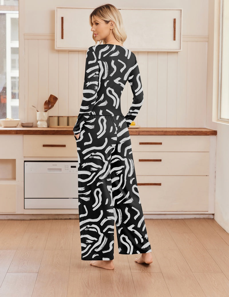 Two-piece set with long-sleeve ruched crew-neck top and wide-leg pants in black/white print.