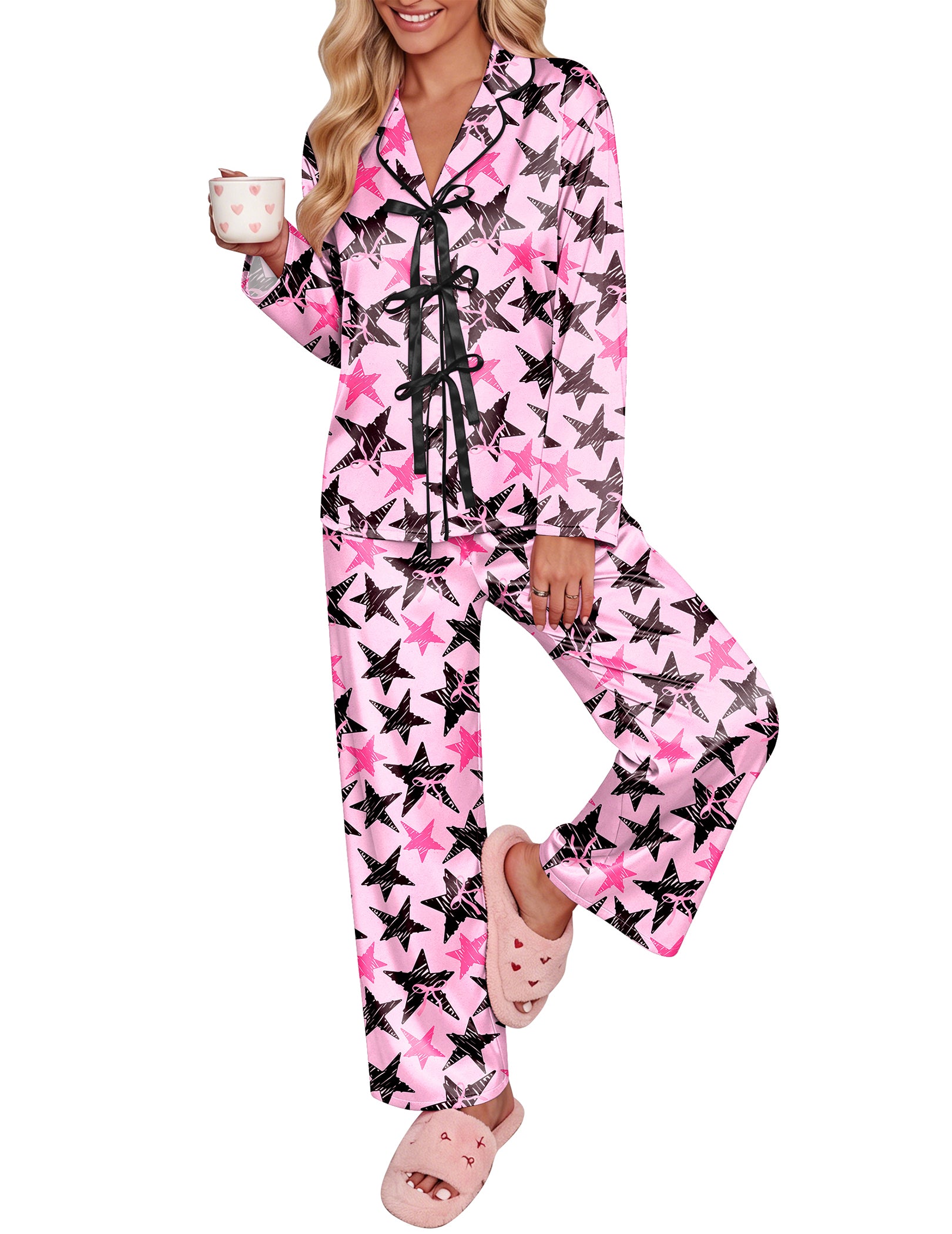 Pink satin pajama set with black star print, long sleeves, bow-tie notch collar