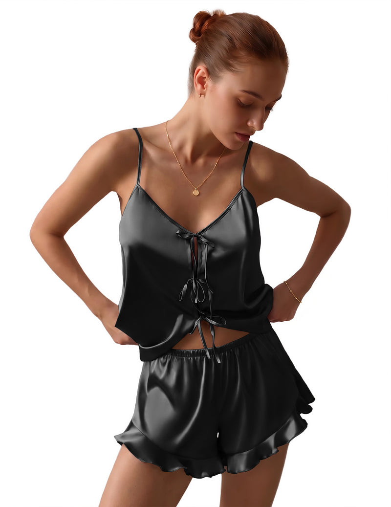 Black satin pajama set with bow-tie front cami and matching ruffled shorts