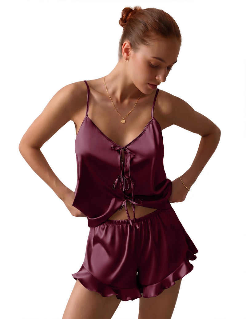 Burgundy satin pajama set with bow-tie front cami and matching ruffled shorts