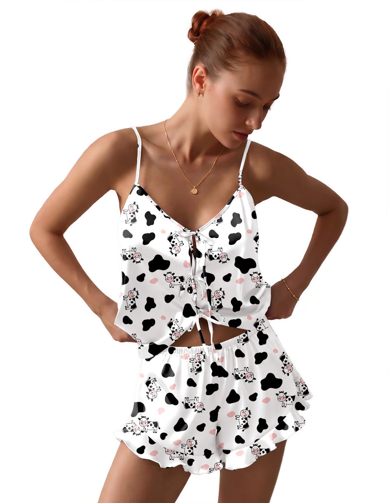 Satin bow-tie pajama set in white with black cow print and ruffled shorts