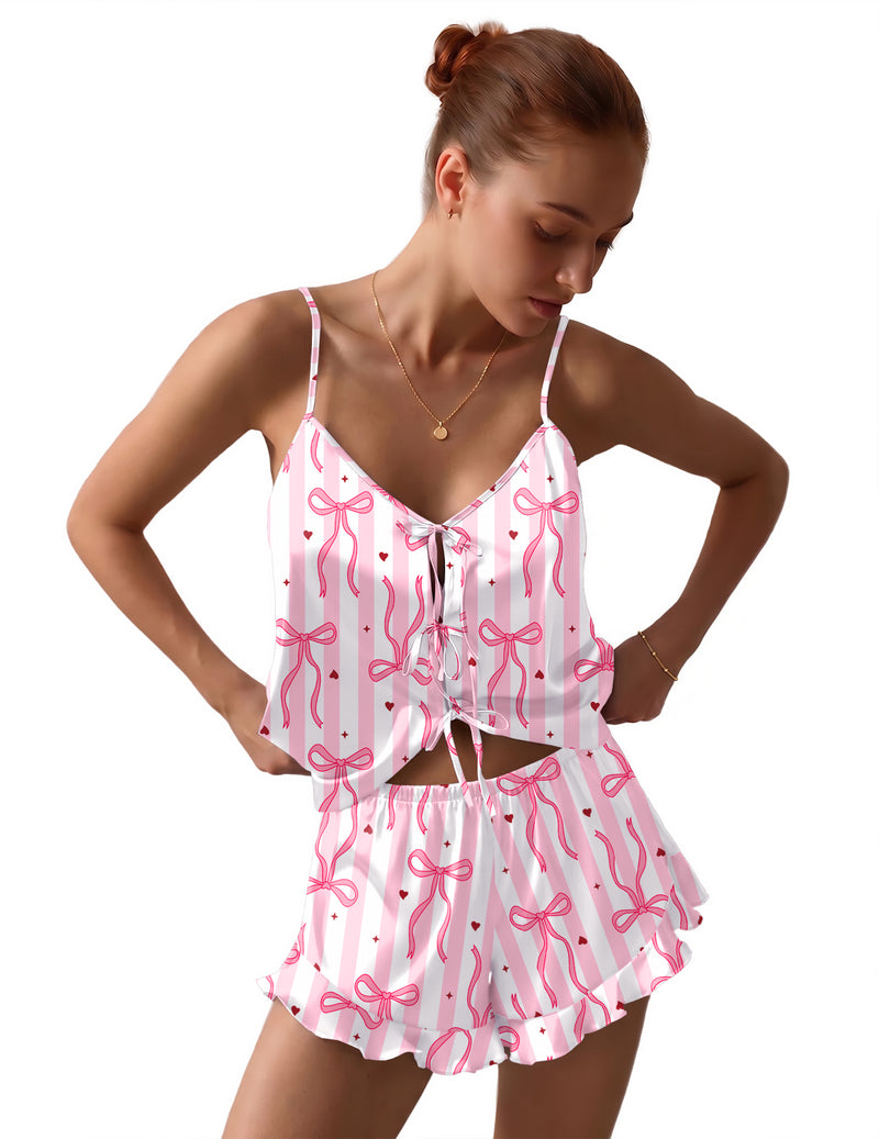 Satin bow-tie pajama set in pink with white bow print and ruffled shorts
