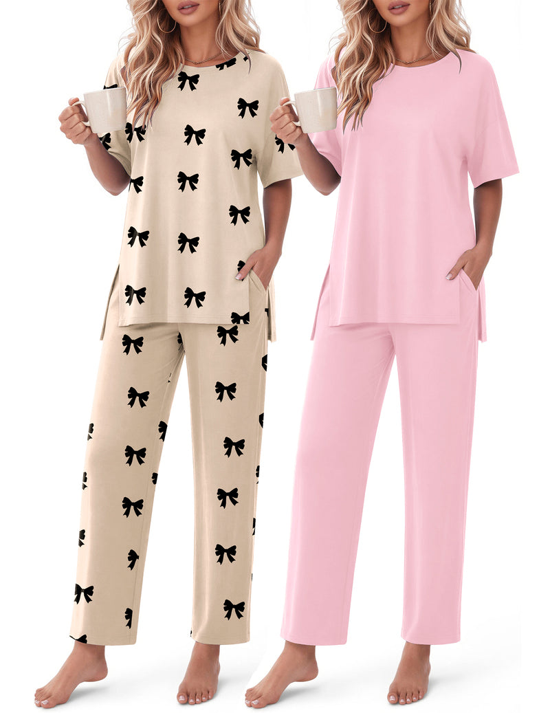 2-piece lounge set: cream top and pants with black bow print; pink matching set.