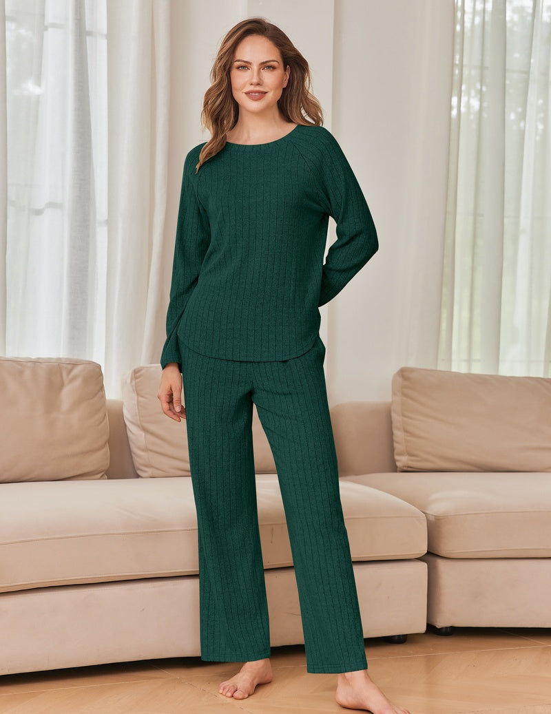 Dark green ribbed knit lounge set with long-sleeve crewneck top and wide-leg pants.