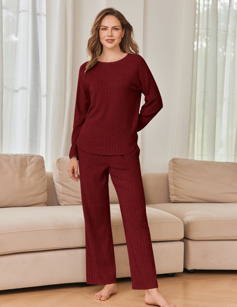 Burgundy ribbed knit lounge set with long-sleeve crewneck top and wide-leg pants.