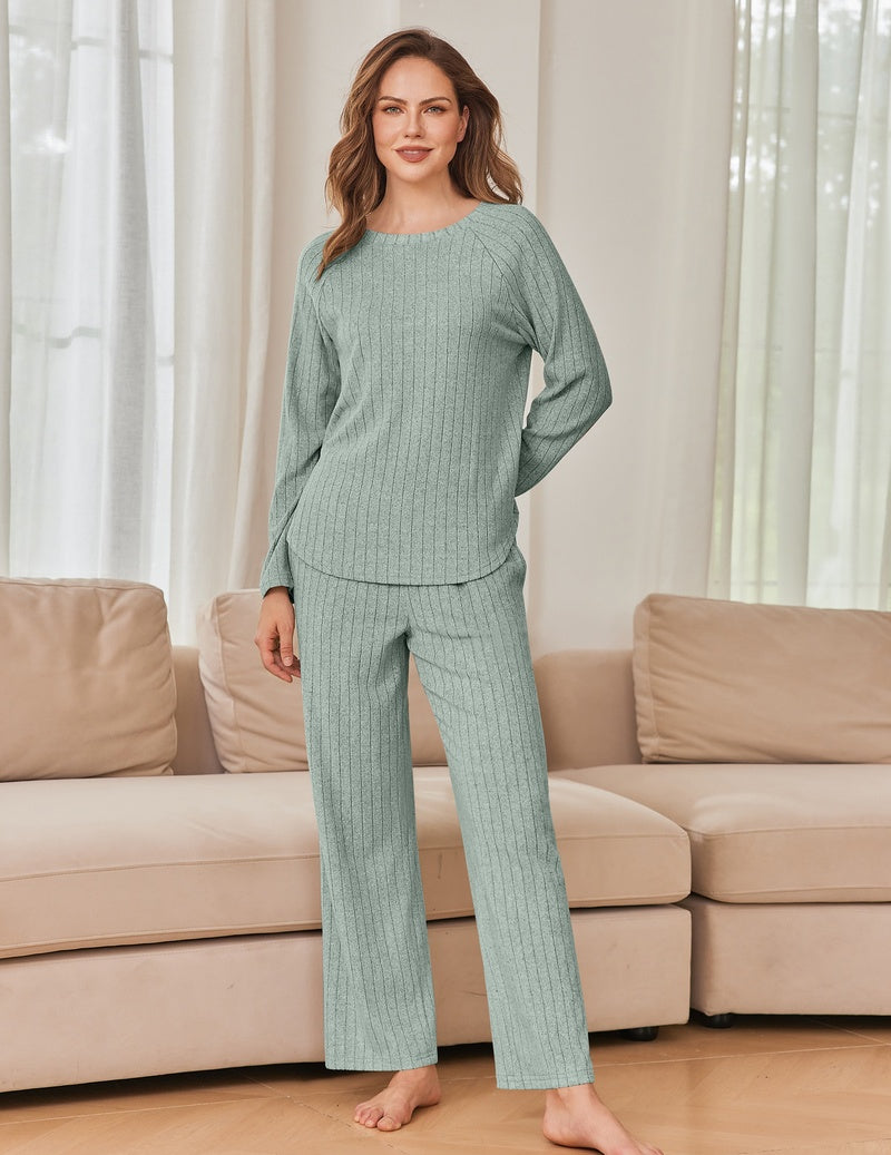 Light teal/seafoam green ribbed knit lounge set with long-sleeve crewneck top and wide-leg pants.