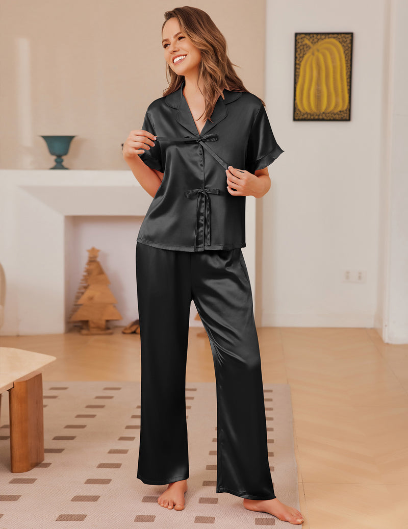Black satin short-sleeve pajama set with tie-front top and matching long pants