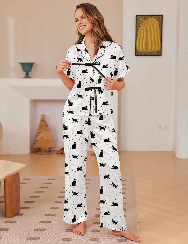White satin with black dog print pajama set with tie-front top and matching long pants