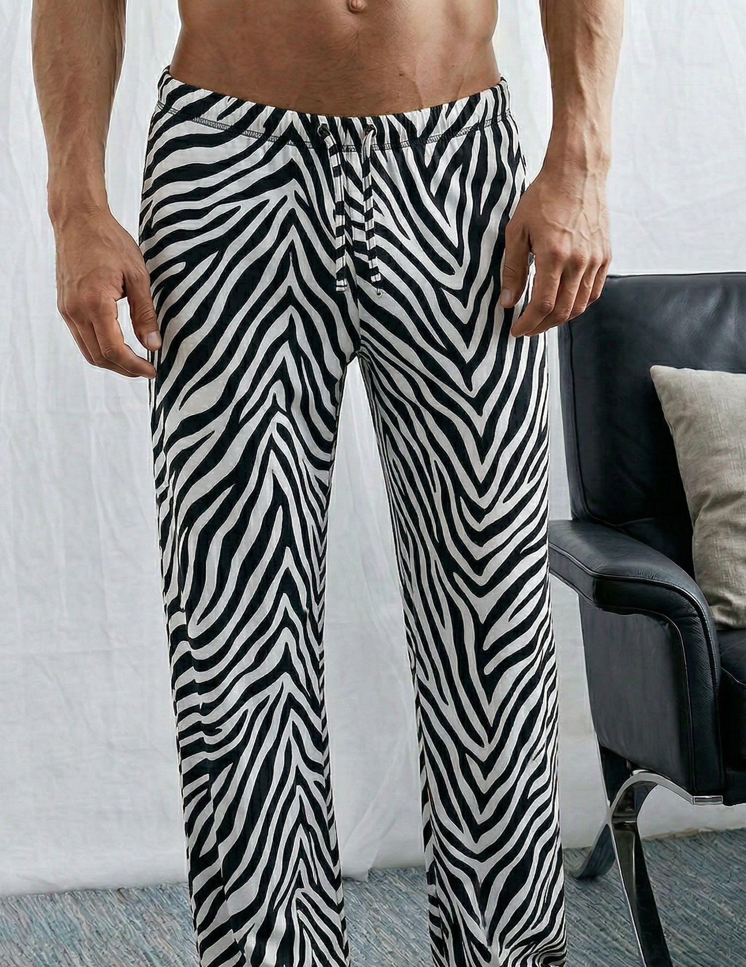 Zebra-pattern sleep pants with elastic waist drawstring and tapered cuffs