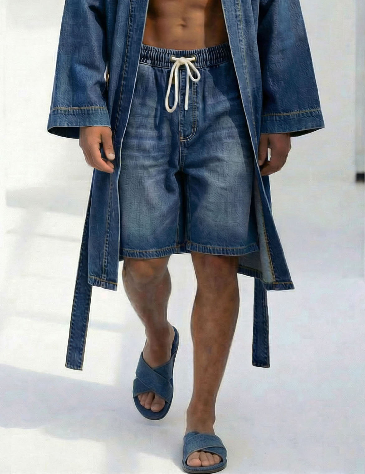 Close-up: blue denim shorts with elastic waistband and drawstring, kimono robe hem