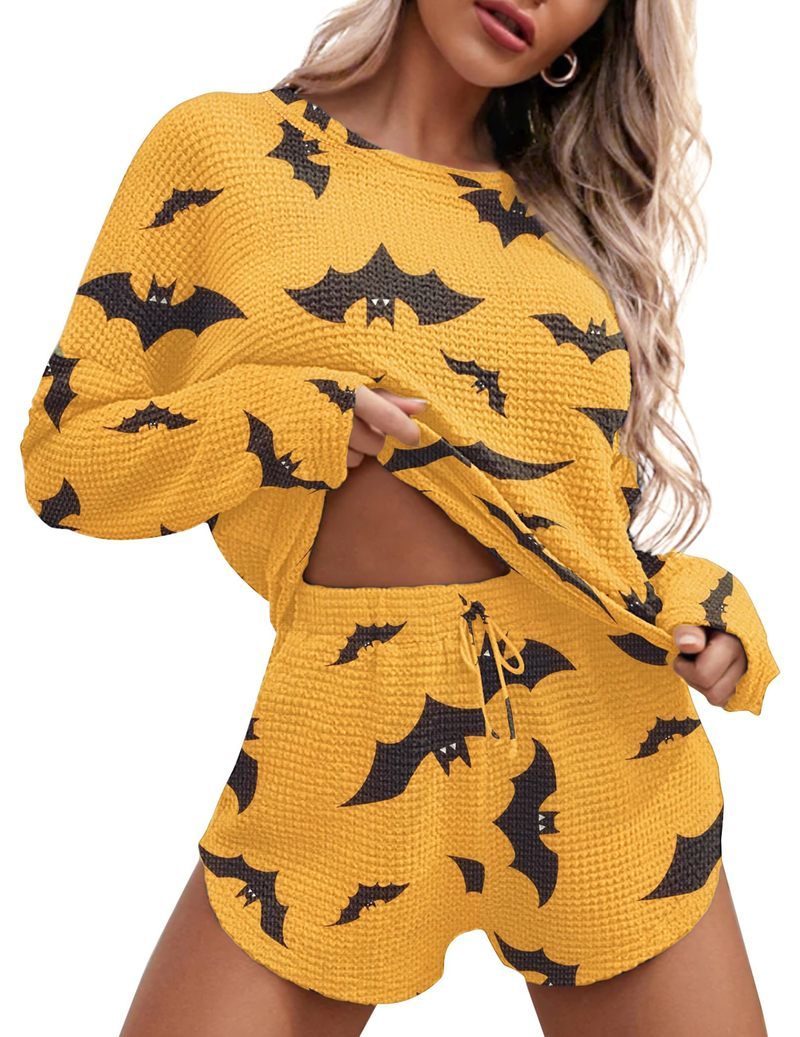 Mustard yellow bat-print lounge set with long-sleeve crew top and drawstring shorts