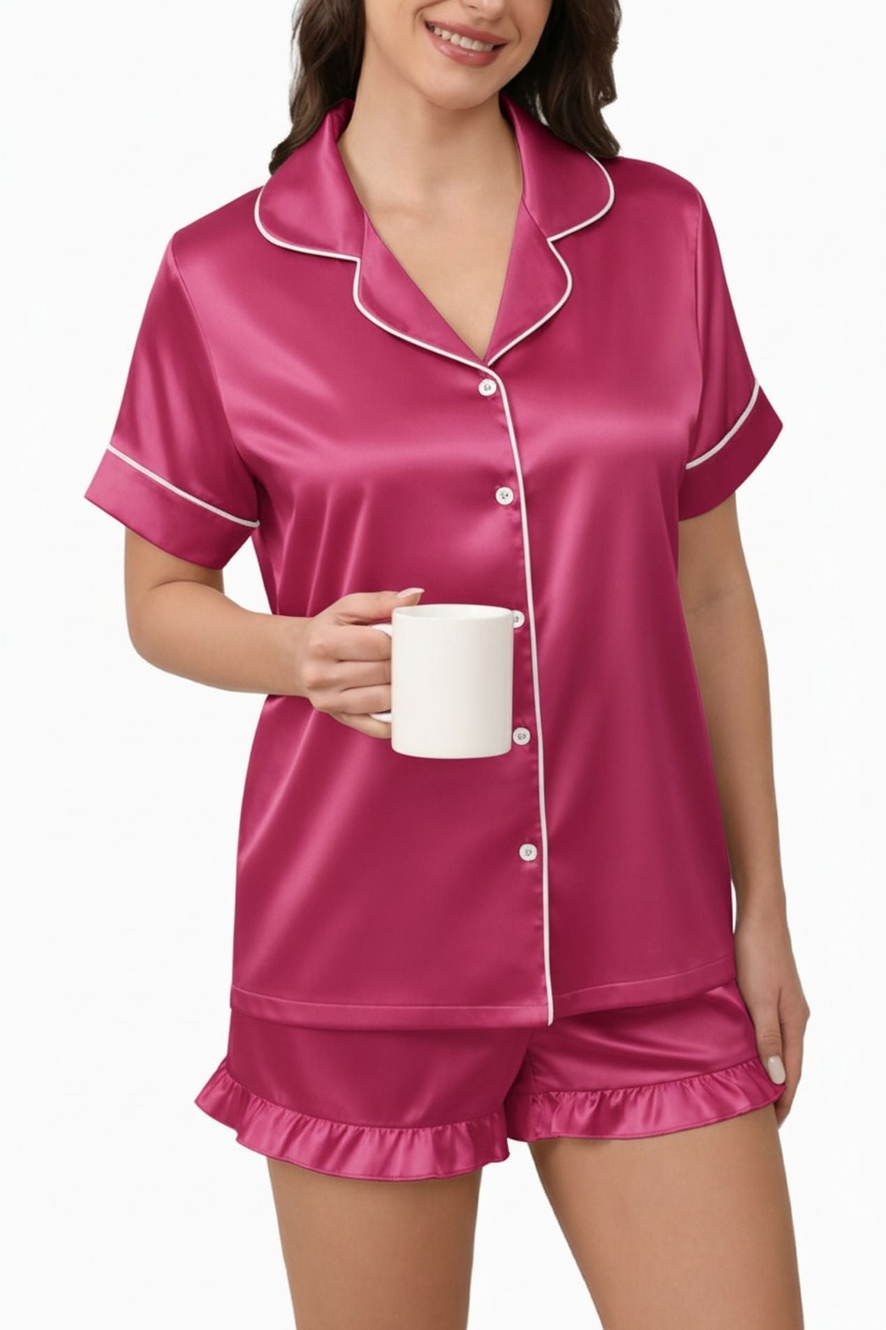 Women's satin pajama set in pink: collared button shirt and ruffle shorts, white piping