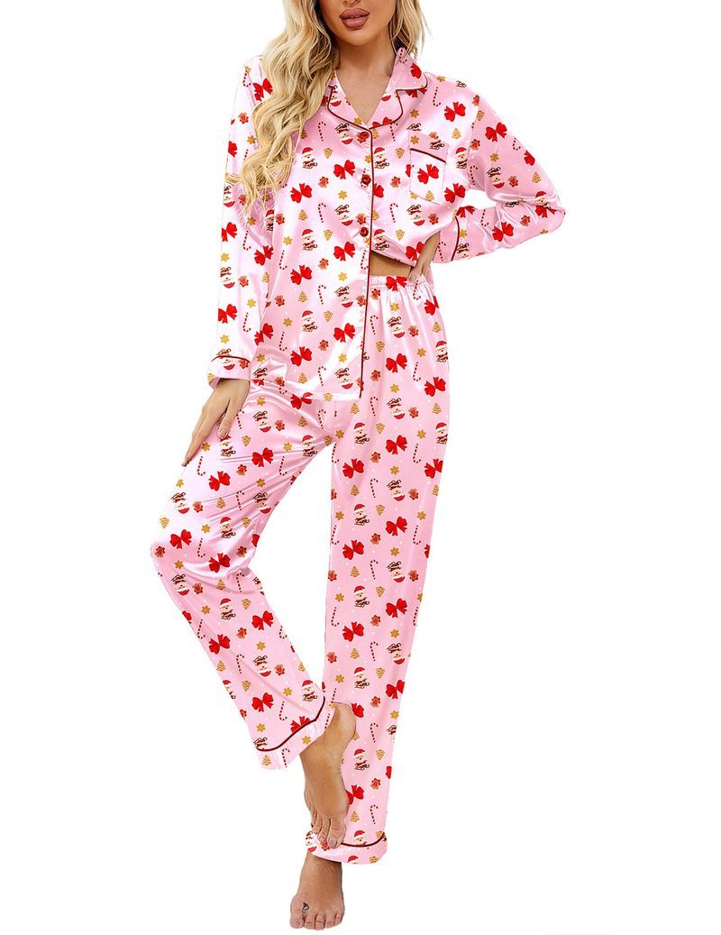 Pink satin pajama set with button-up top and red holiday print pants