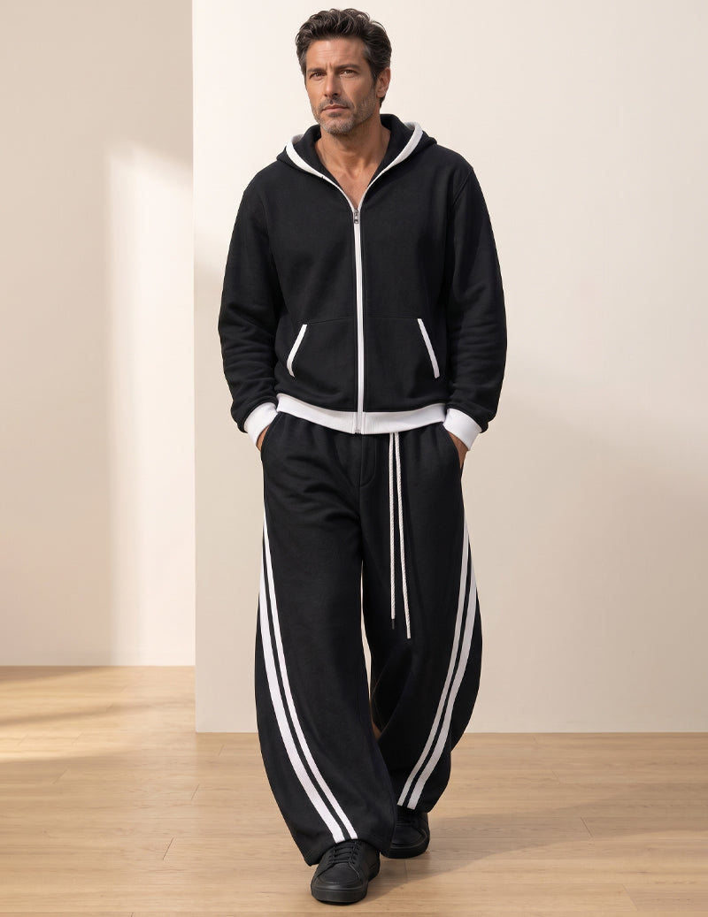 Black hooded tracksuit with white accents, front pockets, and striped joggers