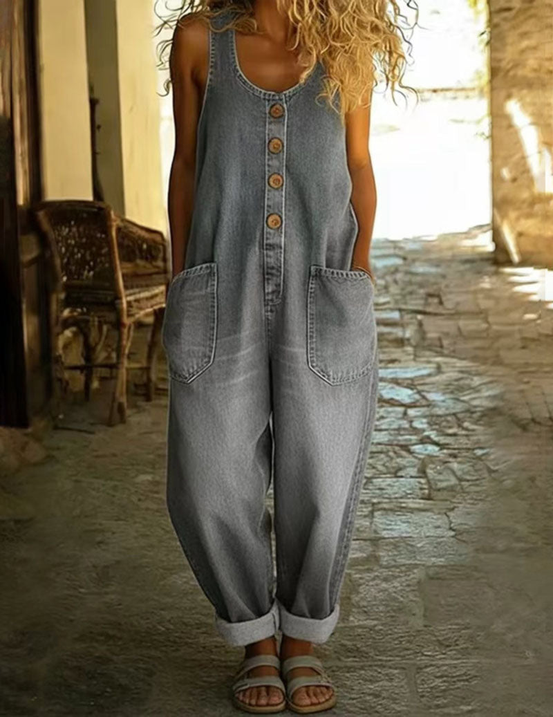 Light grey-blue sleeveless denim jumpsuit with button front and two front patch pockets
