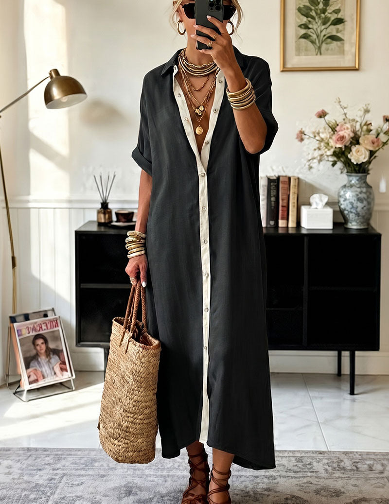 Black oversized shirt dress with collared neckline and contrasting cream button placket