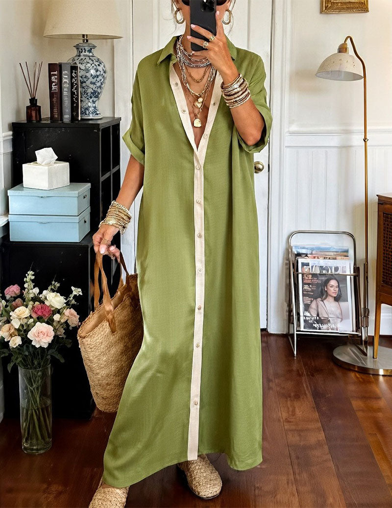 Green oversized shirt dress with short sleeves, collared neckline, and cream contrast placket