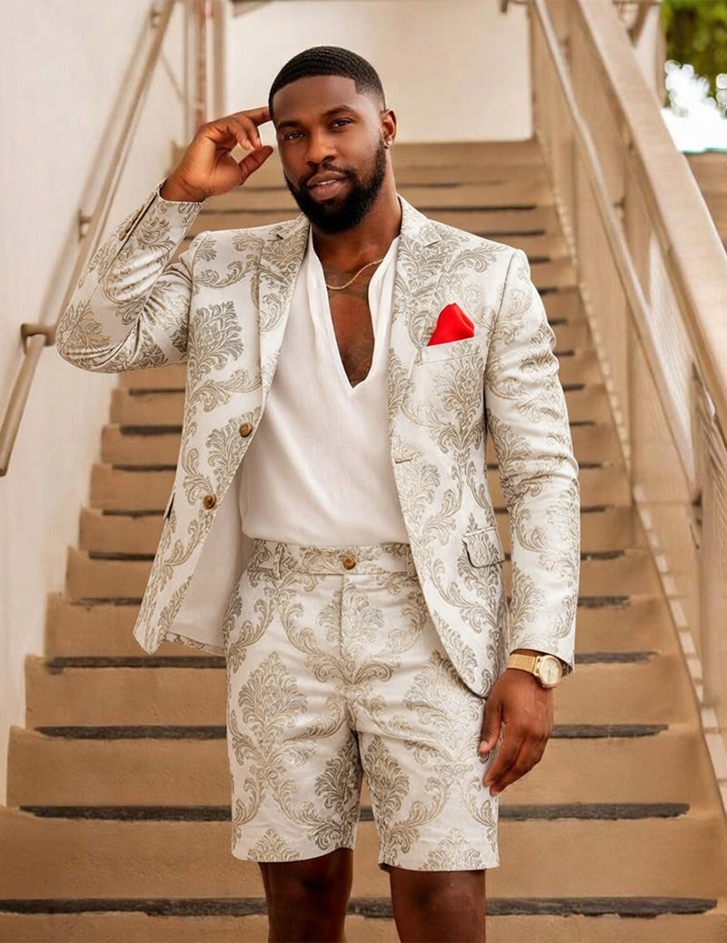 Ornate cream blazer and shorts with gold buttons; red pocket square.