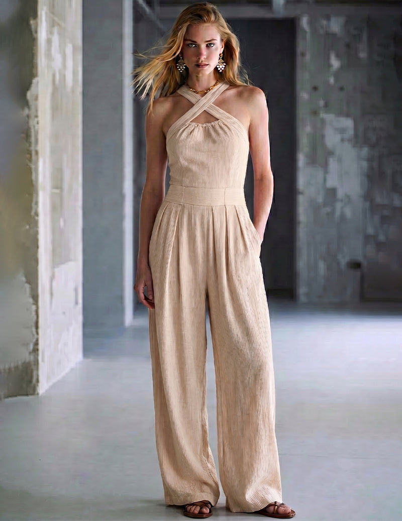 Tan halter jumpsuit with crisscross straps and loose wide-leg pants