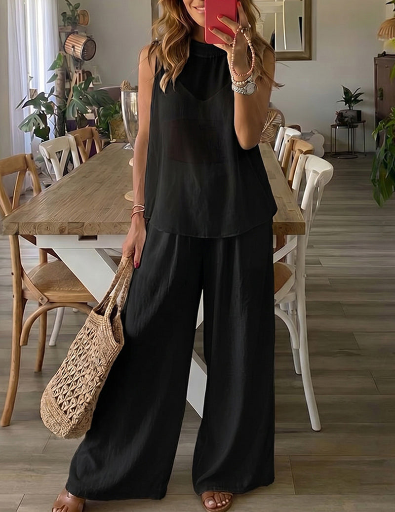 Black lounge set with sleeveless tunic top and draped wide-leg pants