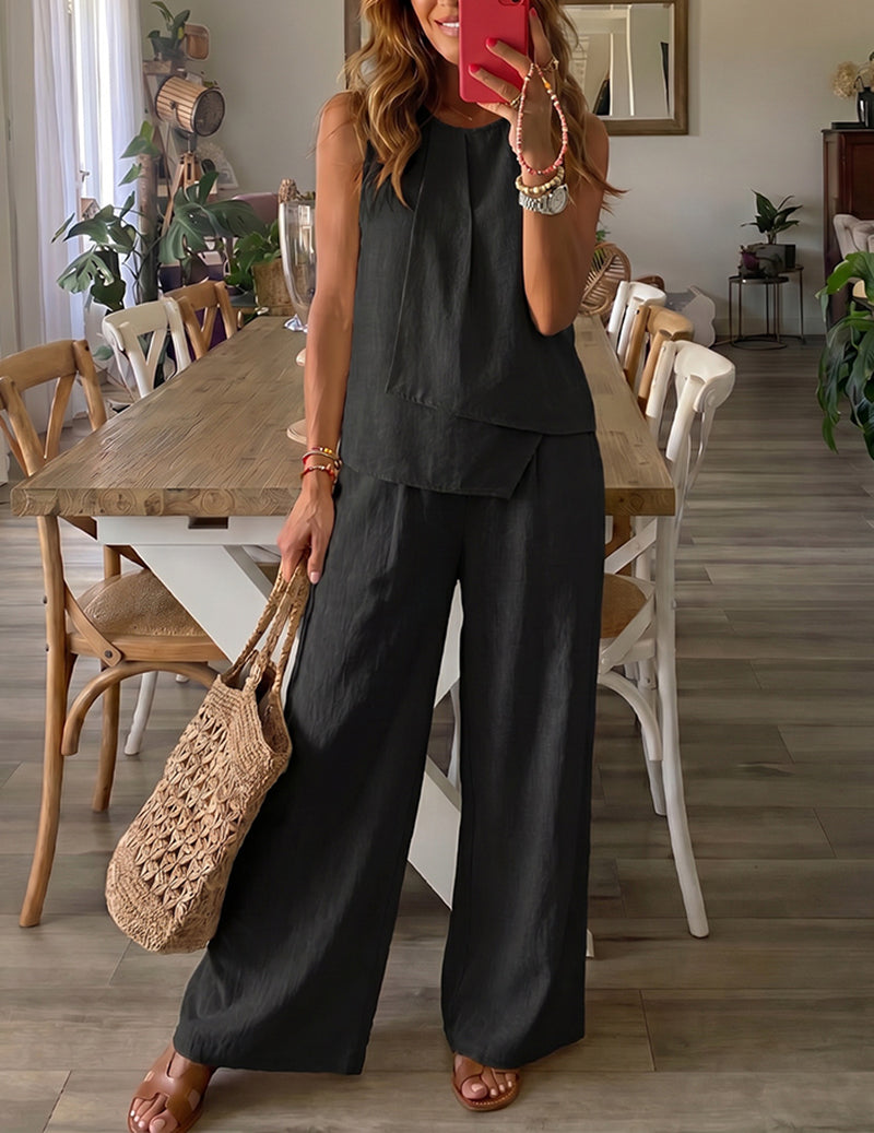Black sleeveless lounge set with ruffle-style tiered top and wide-leg pants.