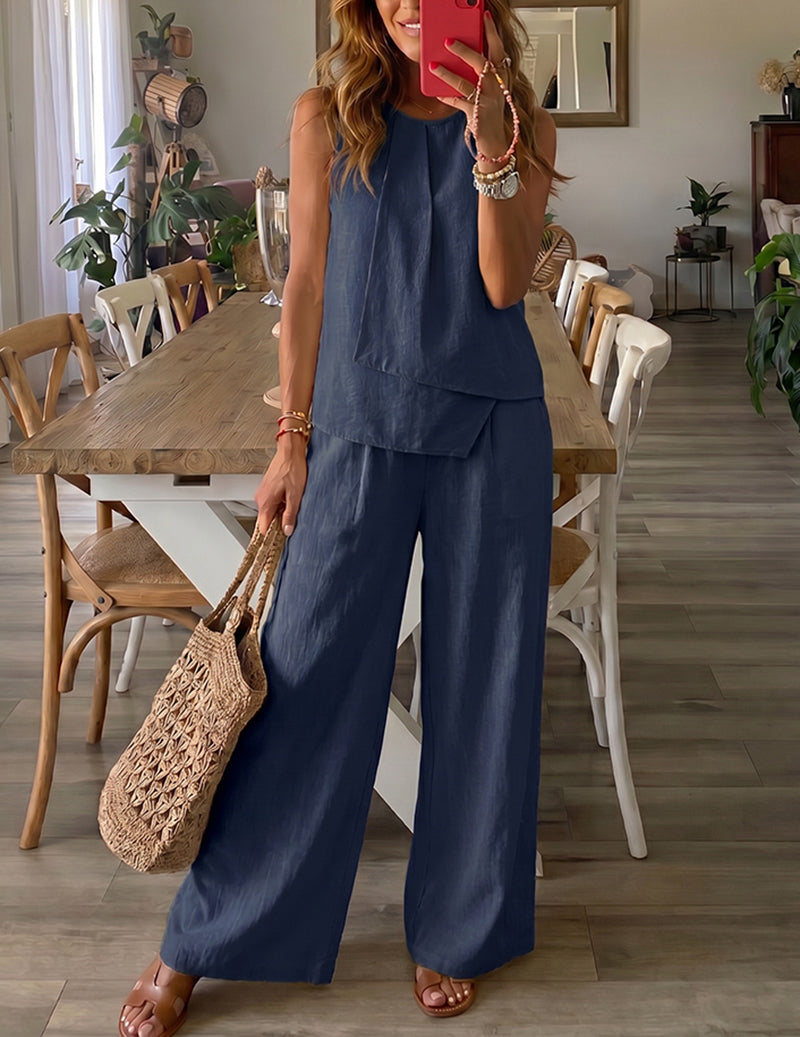 Navy blue sleeveless lounge set with tiered top and wide-leg trousers.
