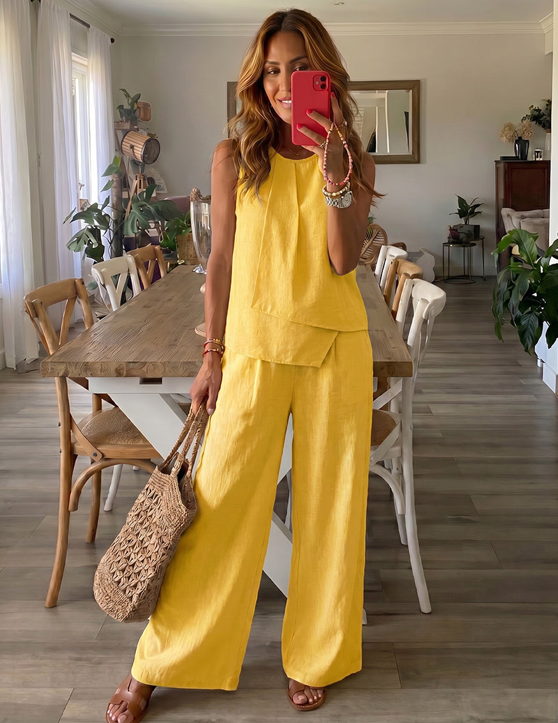 Yellow sleeveless lounge set with tiered top and wide-leg pants.