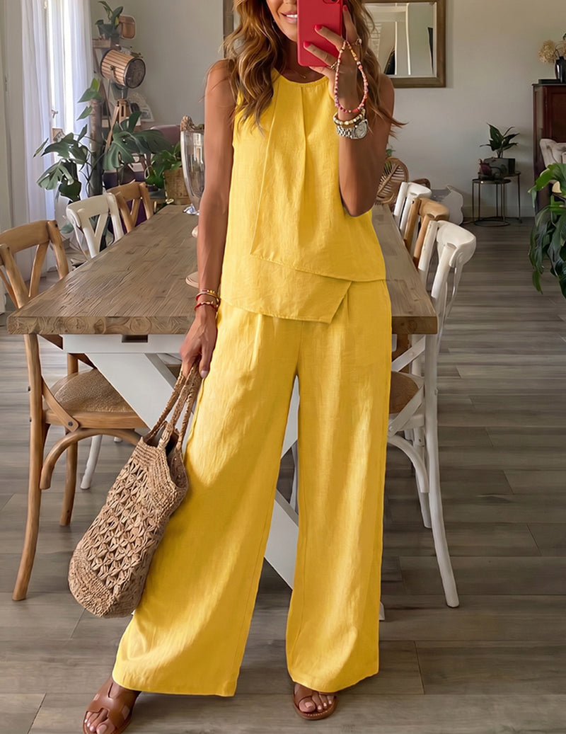 Yellow sleeveless lounge set with layered top and wide-leg pants.
