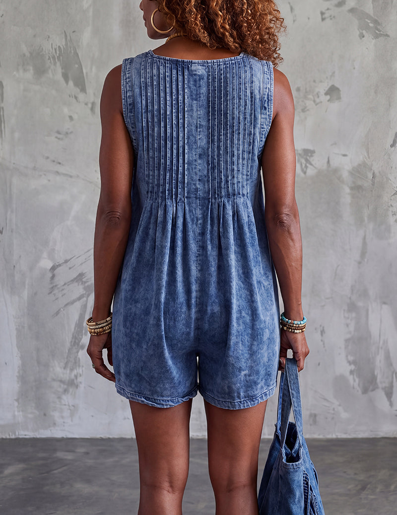 Light blue denim sleeveless romper with vertical seam back and gathered waist