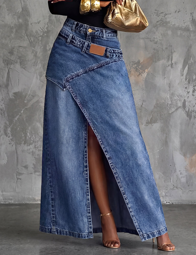 Denim midi skirt in blue with front slit, pockets, belt loops, and tan waist patch