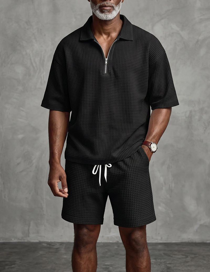 Men's black waffle-knit quarter-zip polo and drawstring shorts set