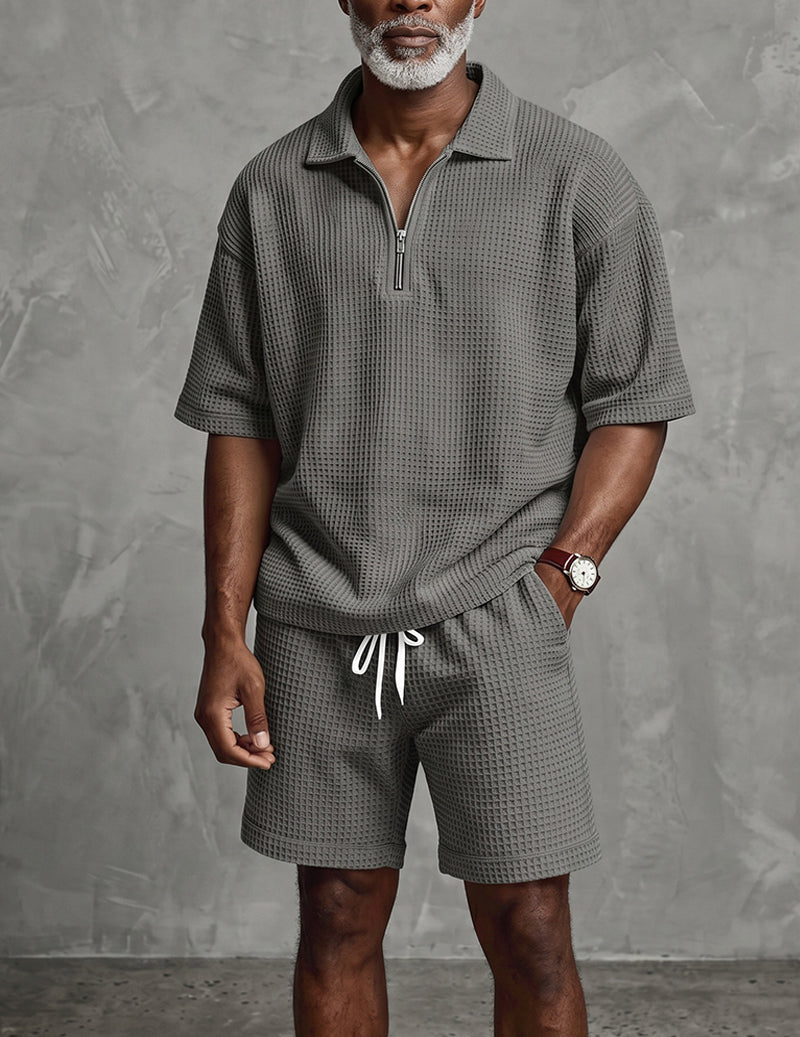 Men's gray waffle-knit quarter-zip polo and drawstring shorts set