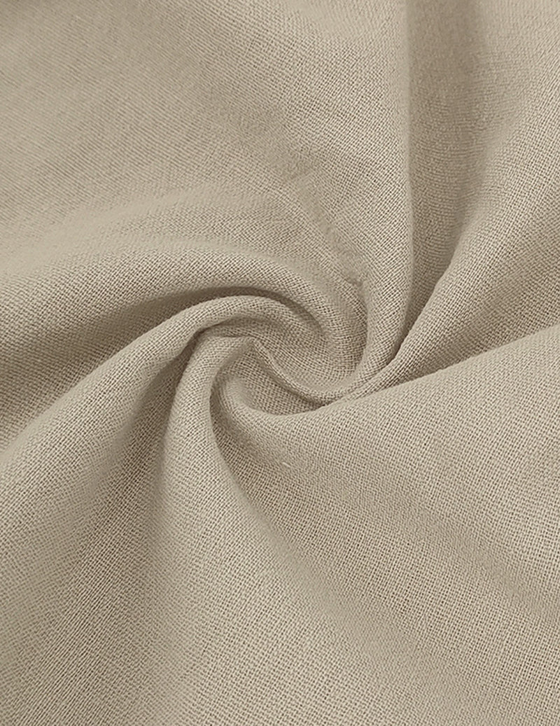 Close-up of light beige linen fabric texture, with soft woven grain