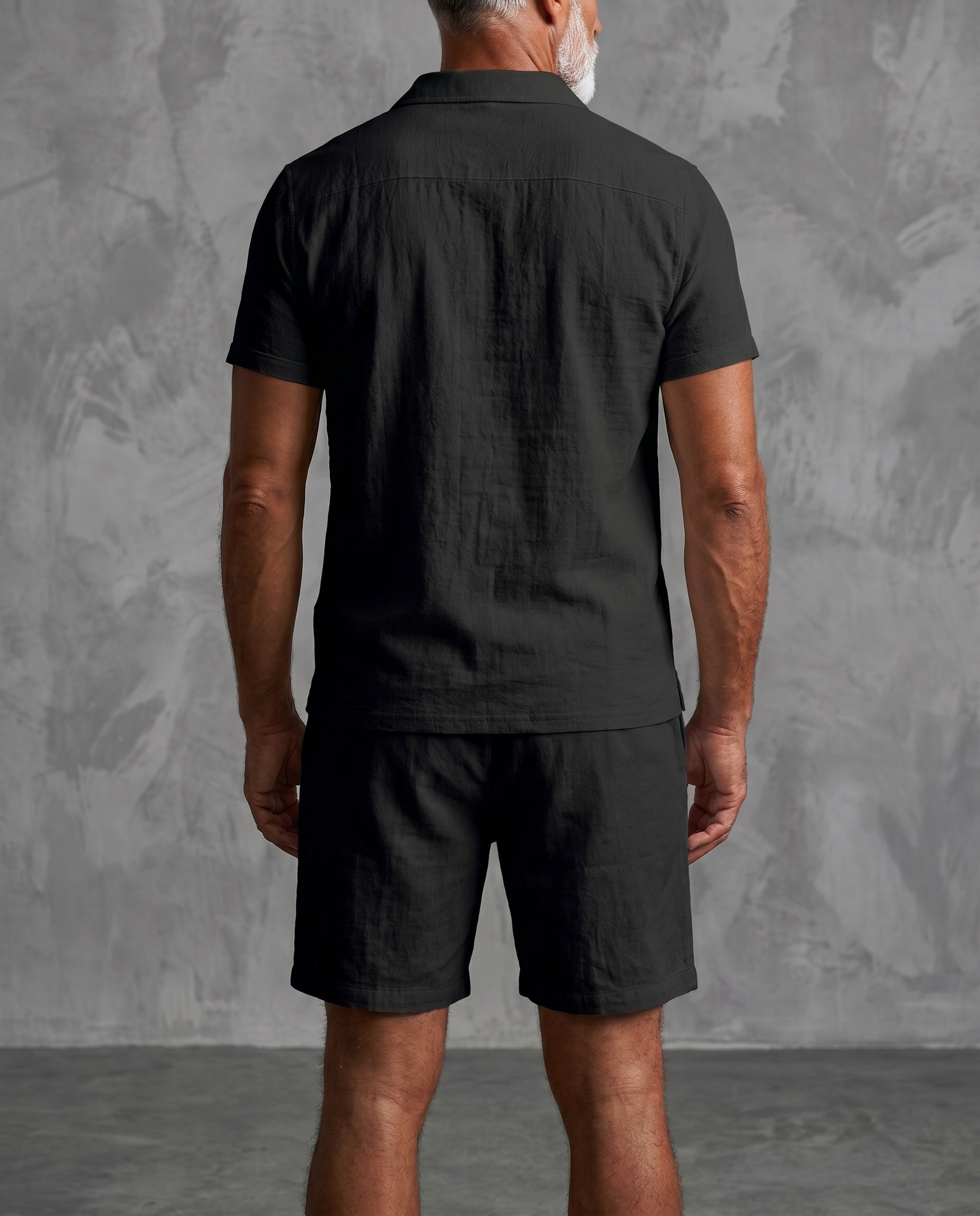 Back view of men’s black linen short-sleeve shirt and shorts set
