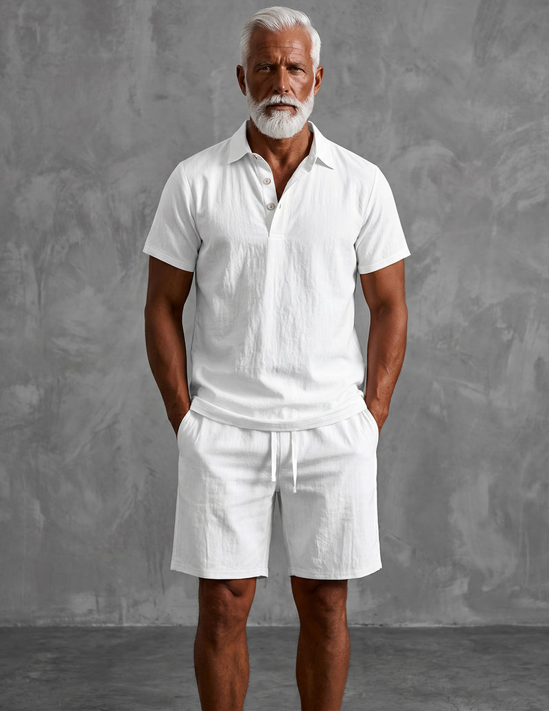 Men's white linen short-sleeve henley shirt and drawstring shorts set, standing