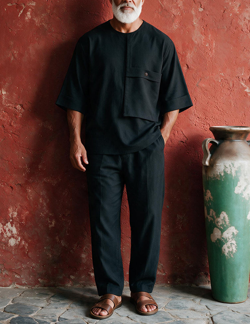 Men's black two-piece loungewear set with patch pocket and matching straight-leg pants