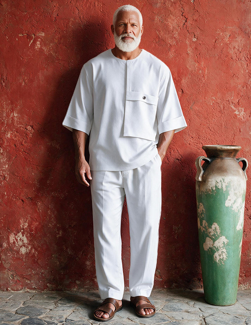 Men's white two-piece loungewear set with patch-pocket top and relaxed ankle-length pants